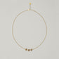 Entdecke Frellinis feine, elegante Kette mit ein, zwei oder drei Charms in Donut Form. Schmuckdesign aus Hamburg.