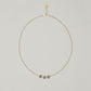 Entdecke Frellinis feine, elegante Kette mit ein, zwei oder drei Charms in Donut Form. Schmuckdesign aus Hamburg.